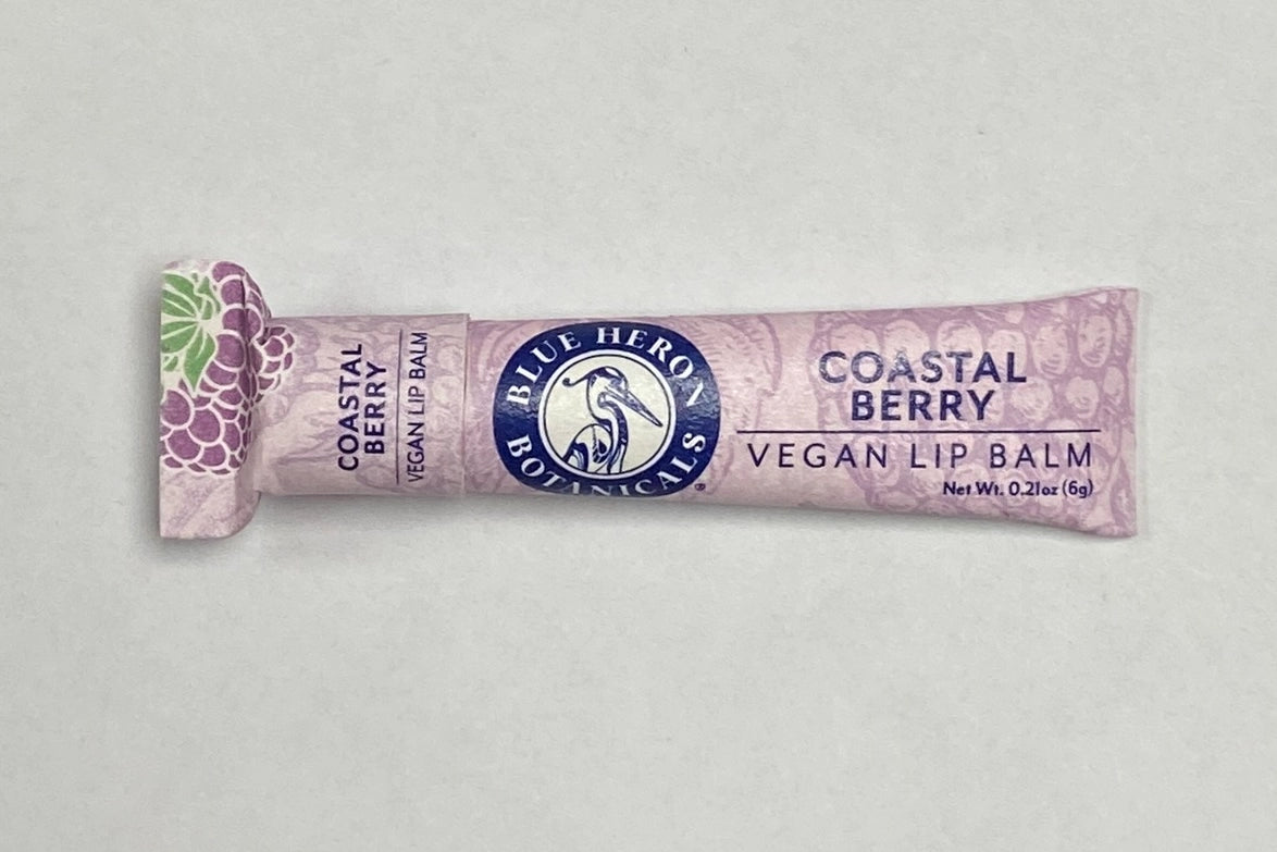 A tube of Coastal Berry Blue Heron Botanicals Lip Balm.