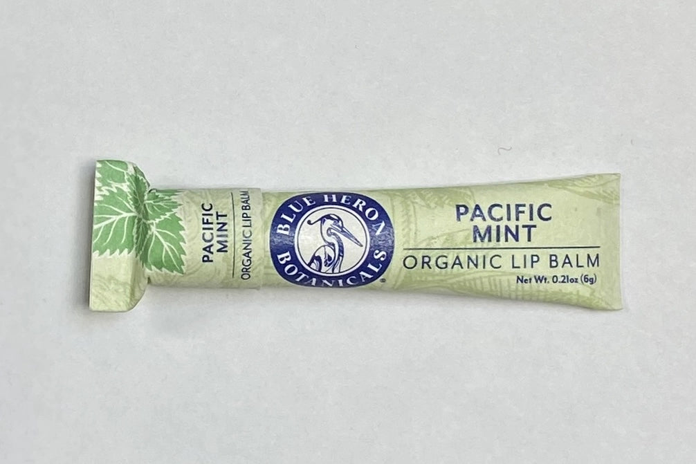 A green plant design tube of Pacific Mint Blue Heron Botanicals Lip Balm.