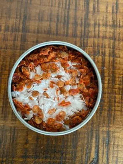 A top down look into a container of B&B Gardens Organic Fermented Chili Salt.